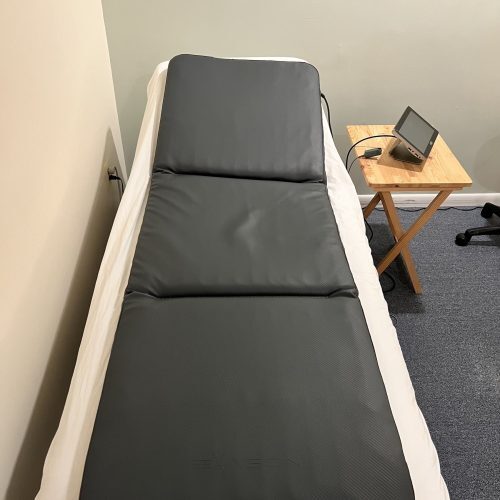 Display of a PEMF mat set up in a treatment room at The Teal Center Arlington