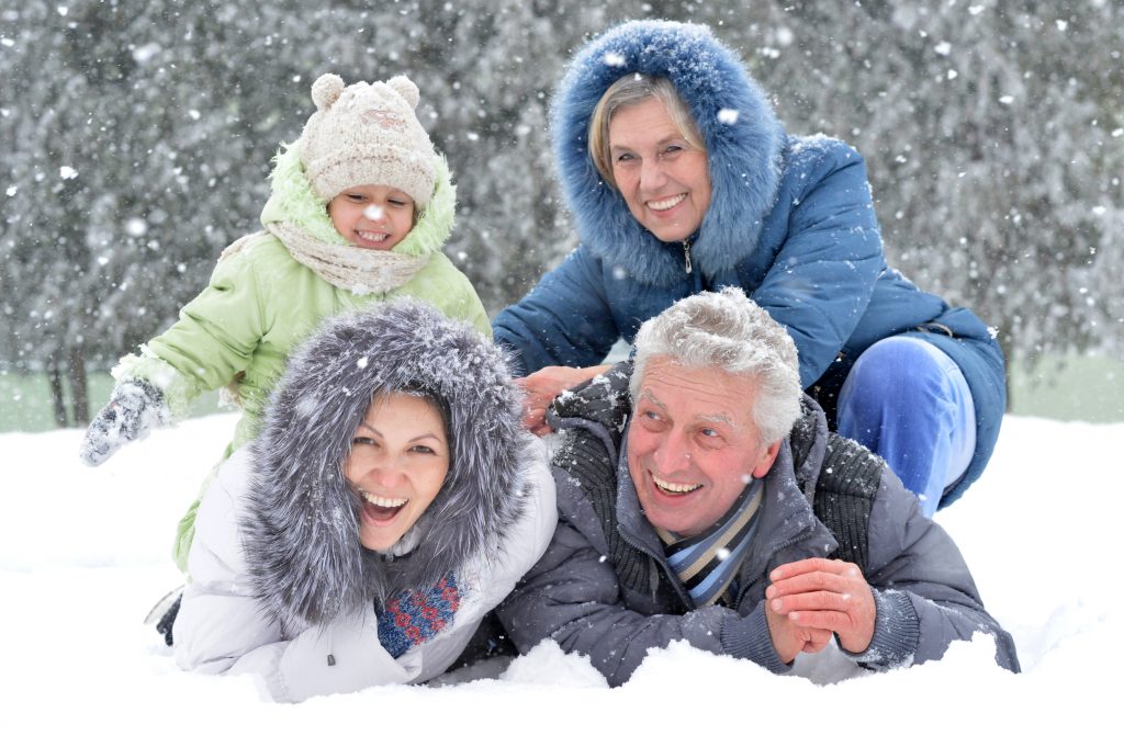 Family playing in the snow