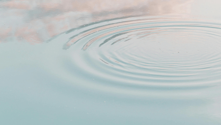 Calm water ripples symbolizing the non-linear healing process at The Teal Center